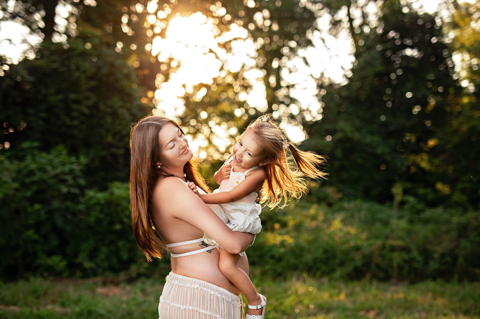Pregnant mom holding toddler