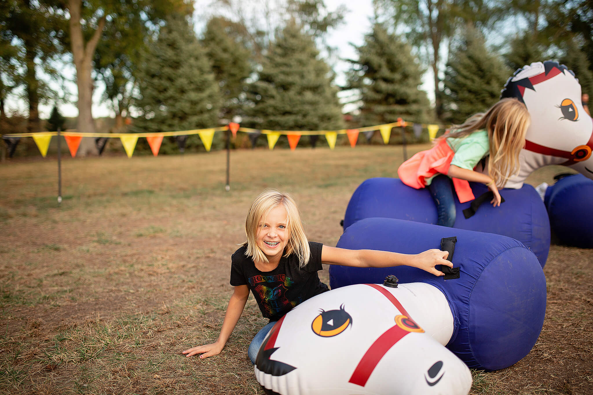 girl laughing falling off toy at pumpkin patch near mansfield ohio
