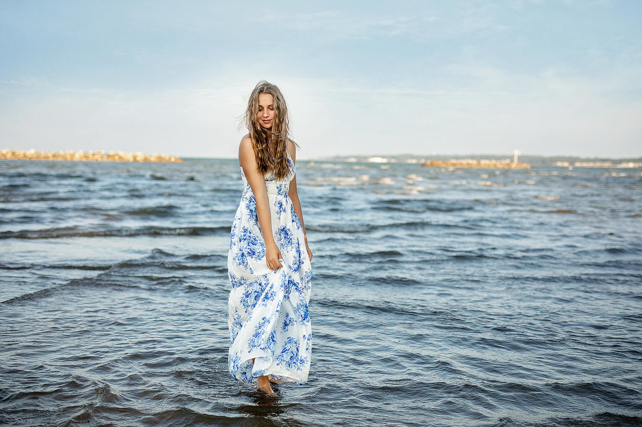 colonel crawford high school senior standing in water for photo at east harbor state park ohio