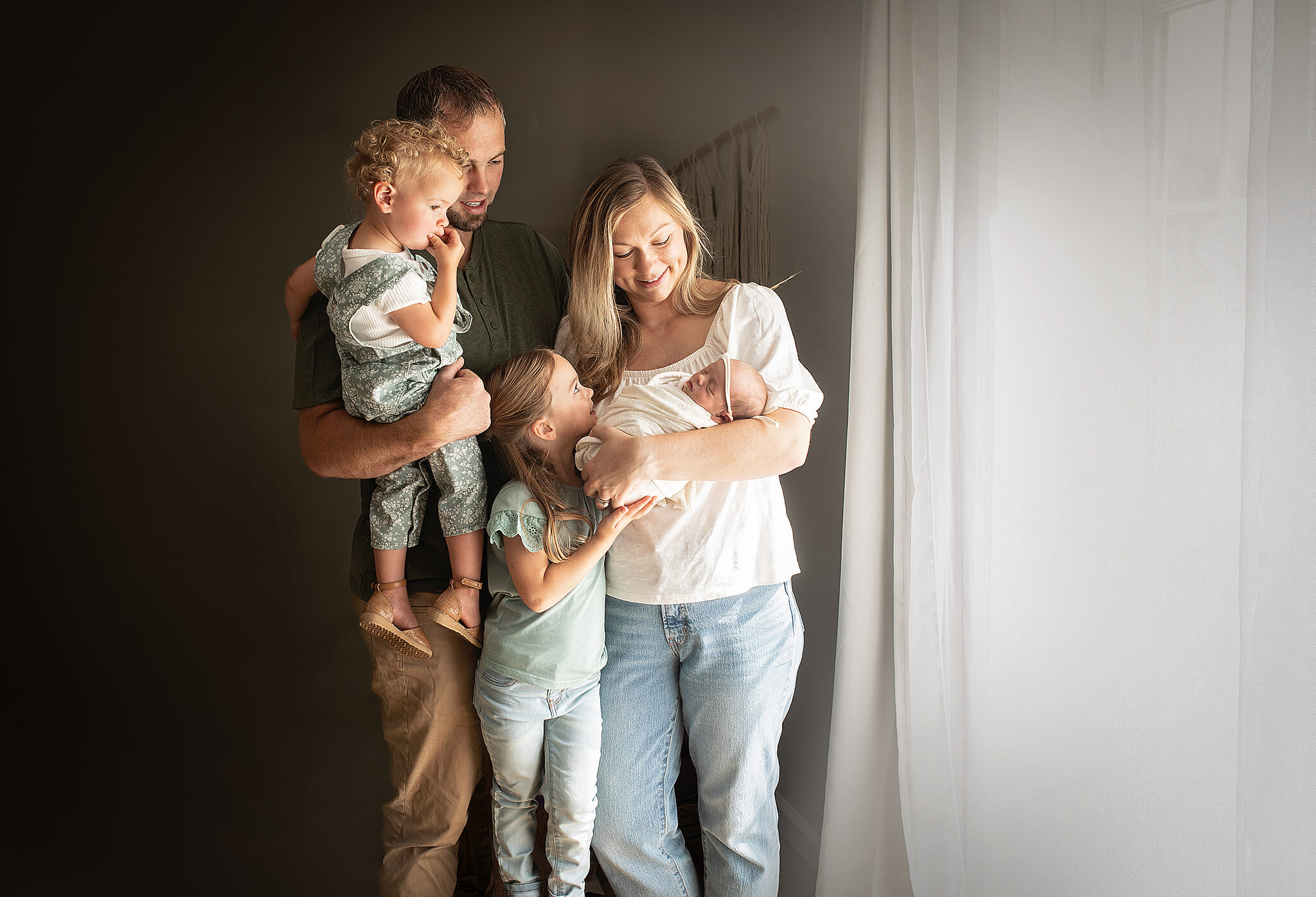 Studio photography in bucyrus ohio for a family of five. Mom and dad with 3 girls