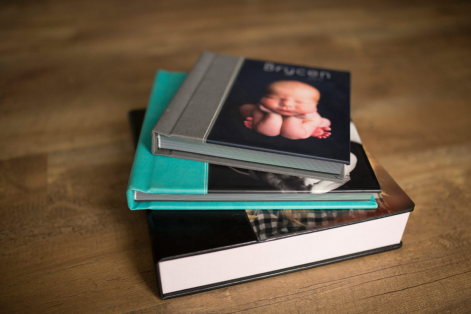 albums stacked on top of each other - another creative way to display your photos at home