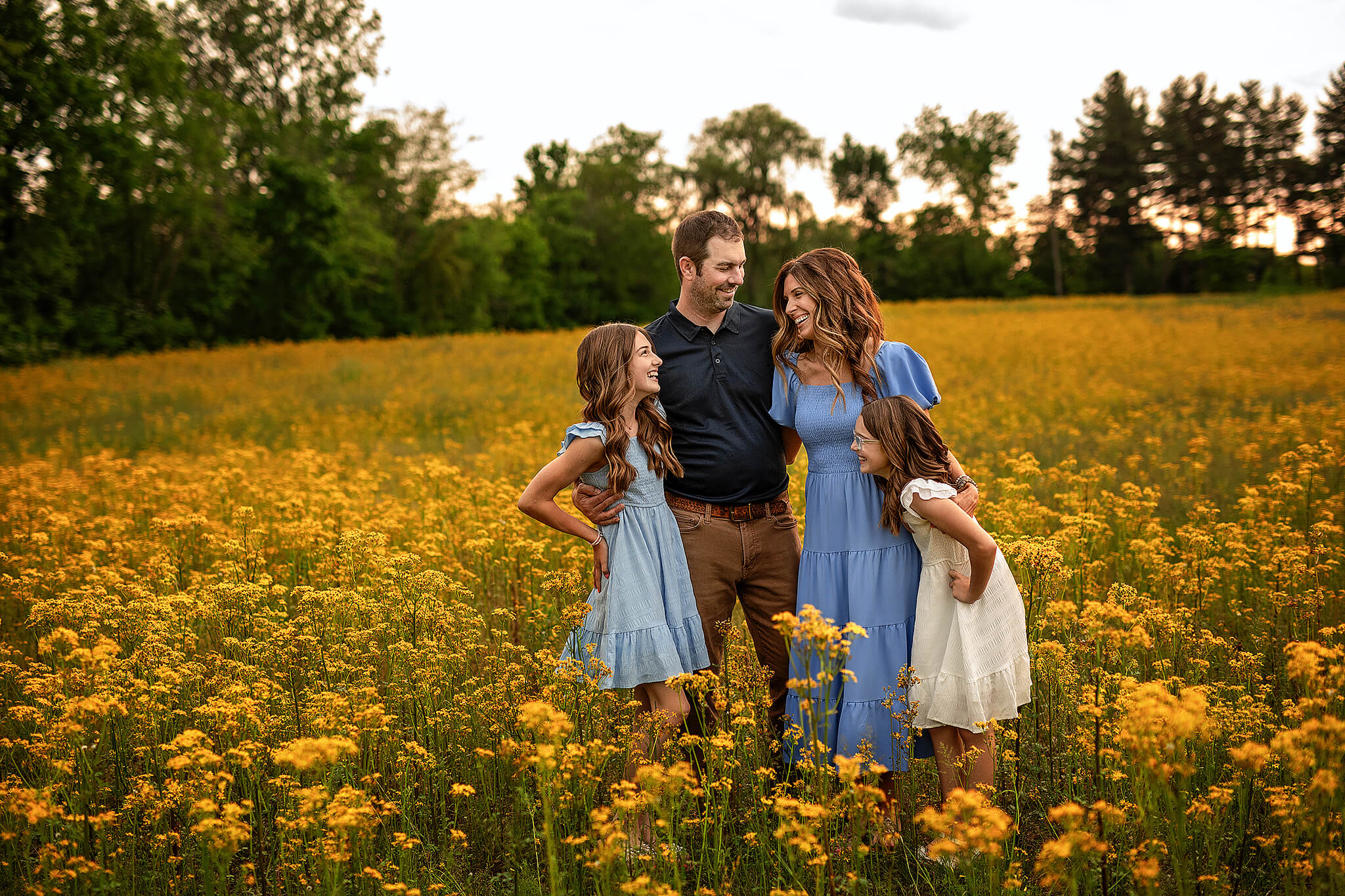 Family wearing neutral outfits during outdoor photo session in ohio