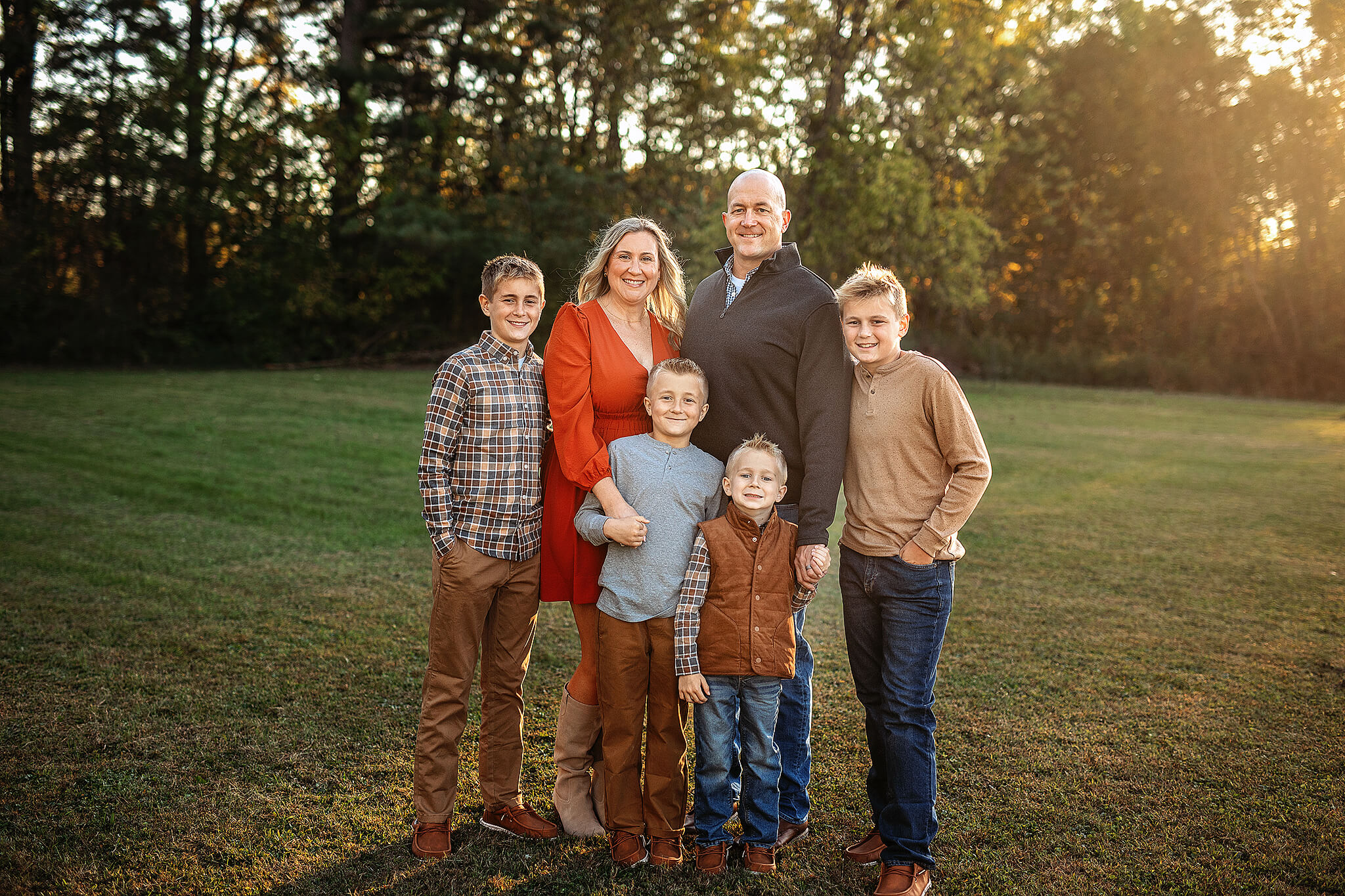 Family wearing neutral outfits during outdoor photo session in ohio