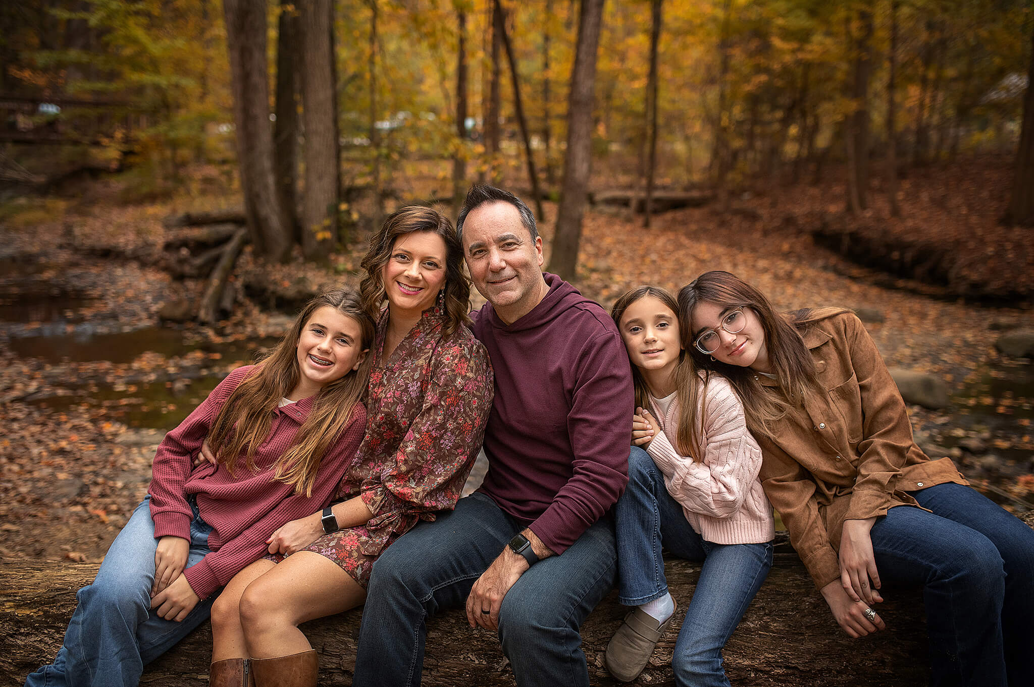 Family wearing neutral outfits during outdoor photo session in ohio